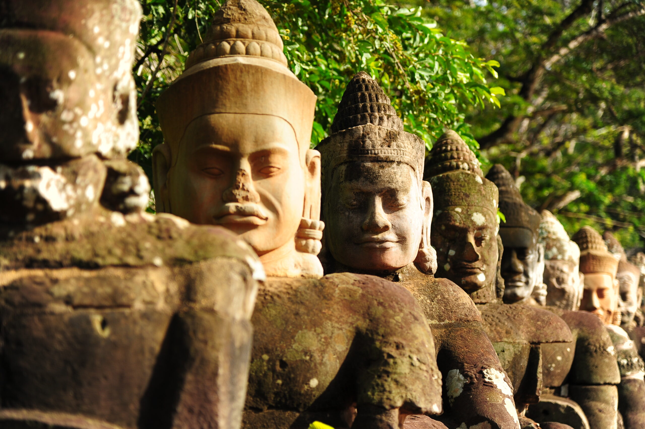Row of ancient statues; Cambodia travel tips for exploring the local culture