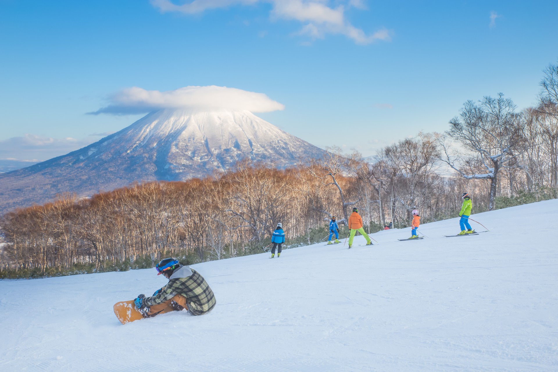 Families skiing in Hokkaido, one of the best places for visiting Japan in December