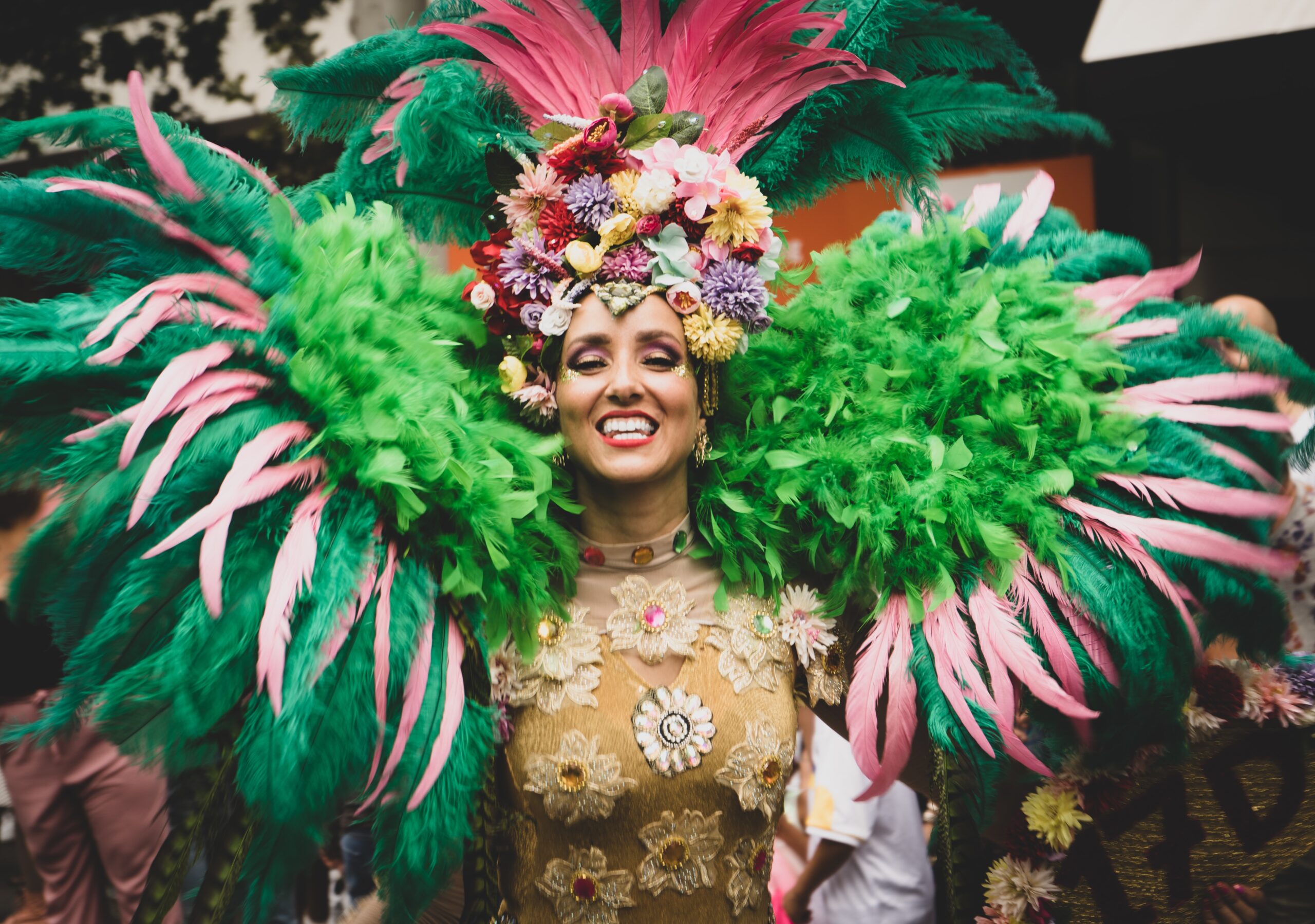 Find out the best time to visit Brazil for Carnival; dancer in vibrant attire