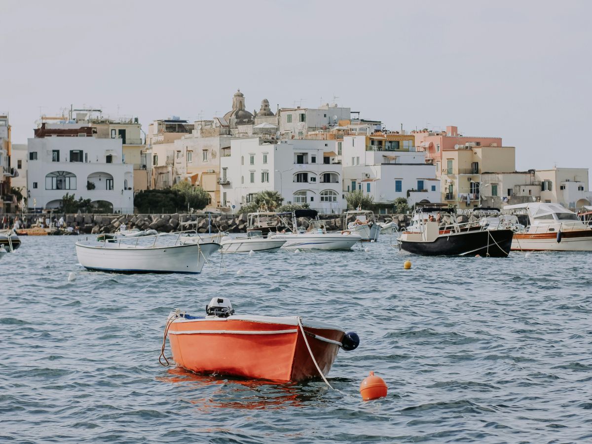 Boat bobbing by a marina on the island of Ischia, Italy