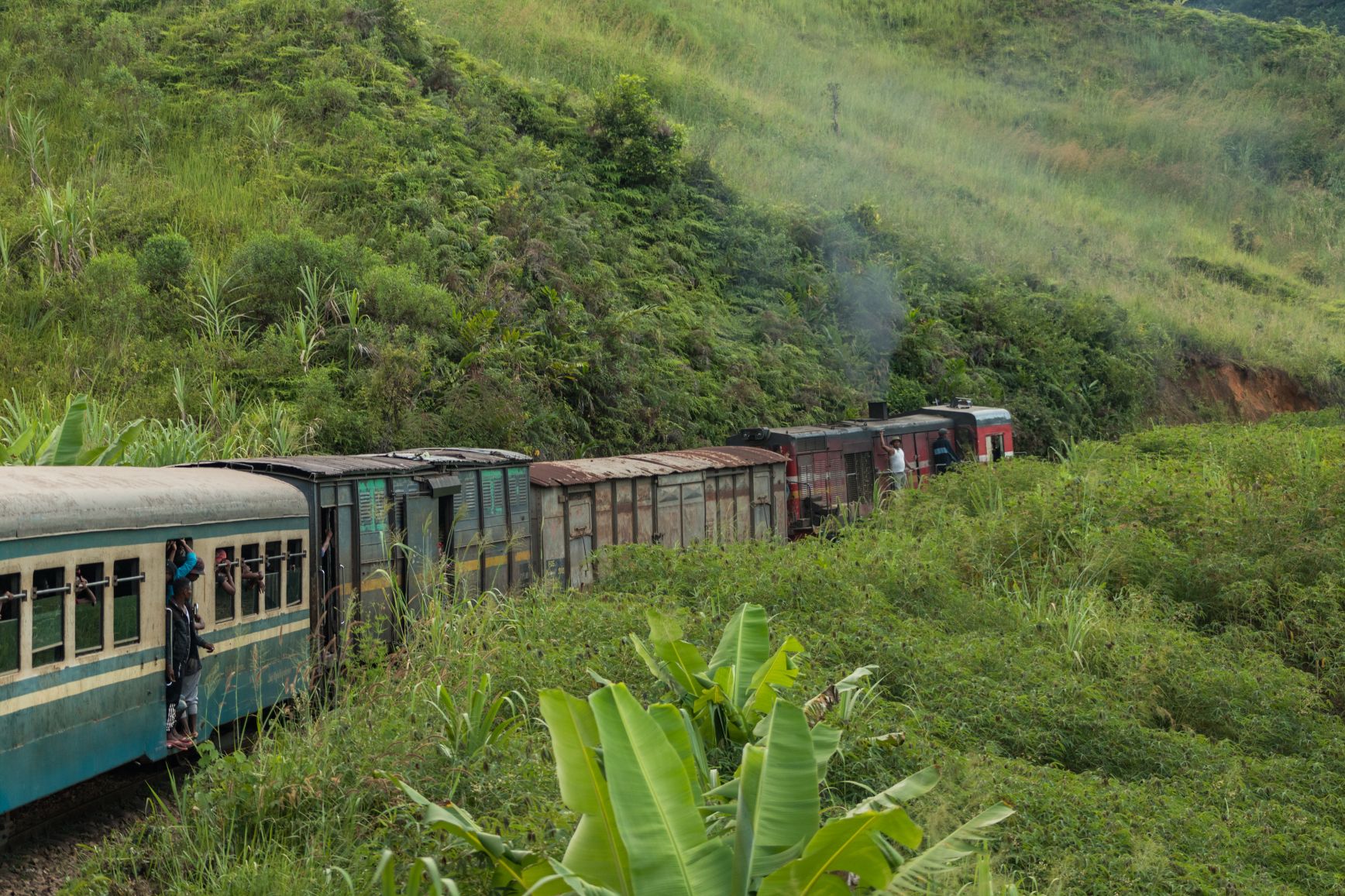 Unique things to do in Madagascar: take an old train through the lush green countryside