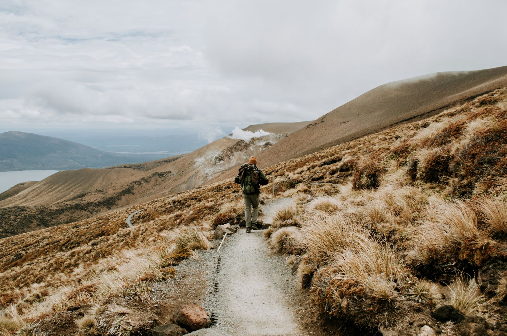 Slow travel destinations: person hiking in Tongariro, New Zealand
