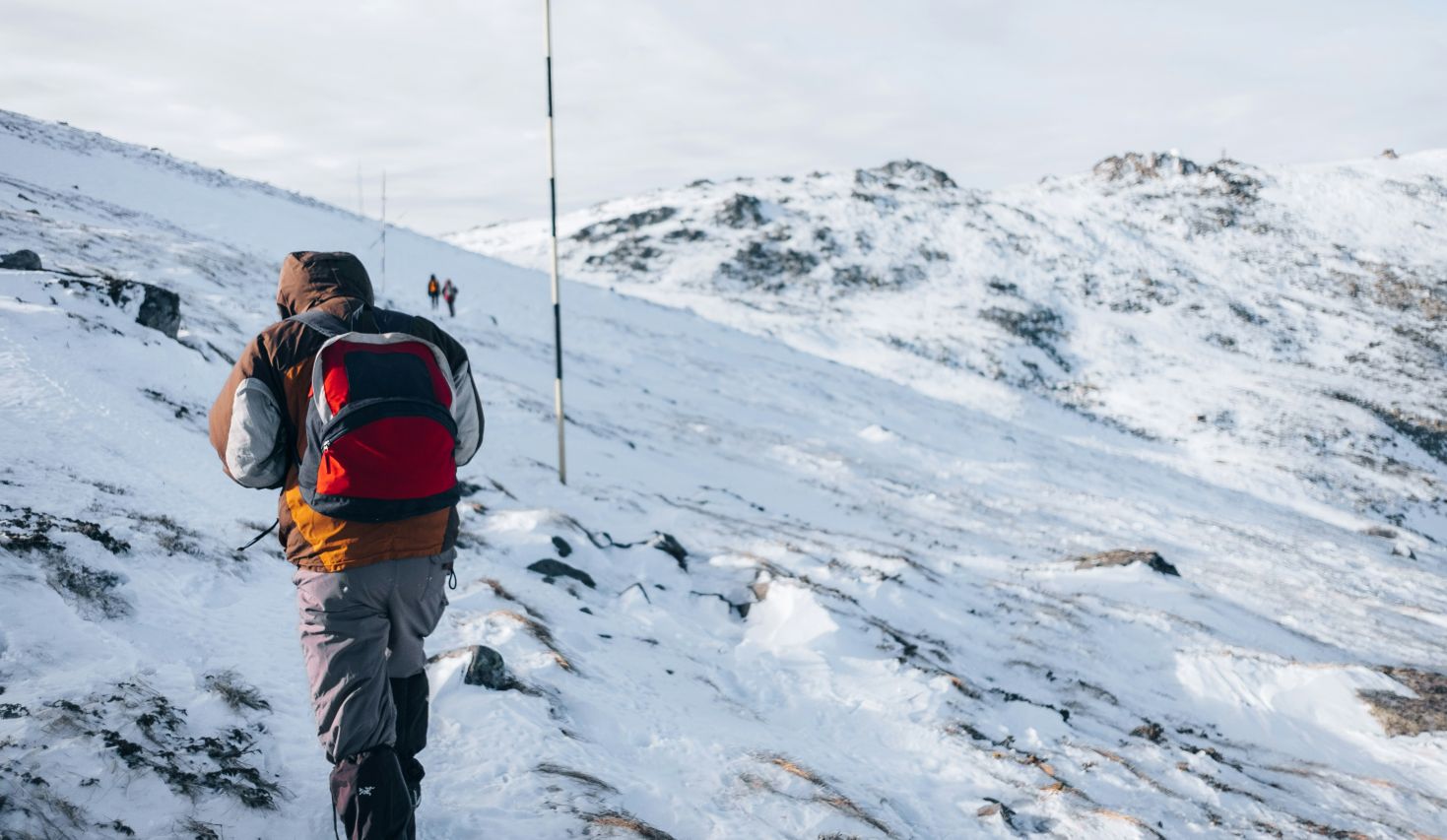 Person hiking up the snowy Vitosha Mountain