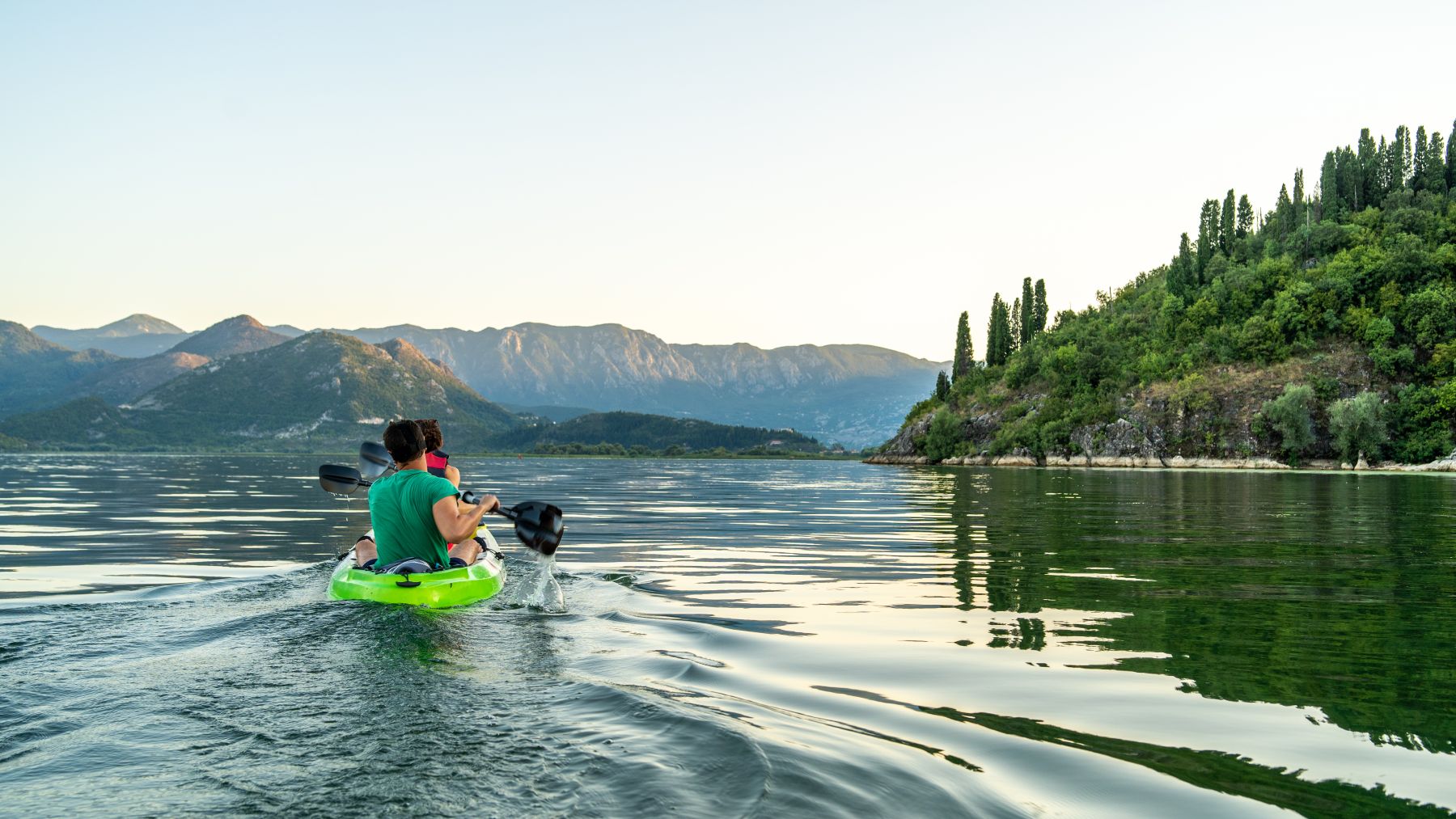 People kayaking on Lake Skadar, one of the best Balkan destinations for outdoor lovers