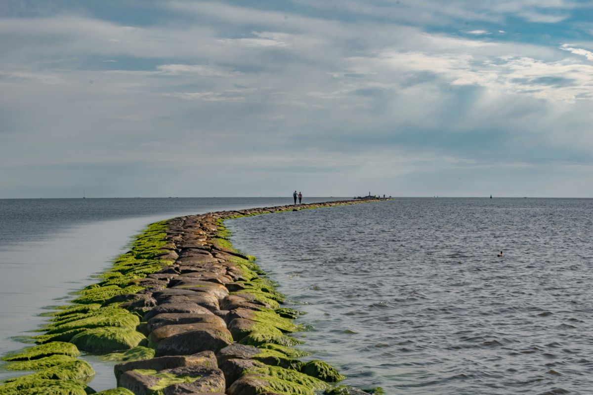 People walking down the mole of Pärnu in Estonia