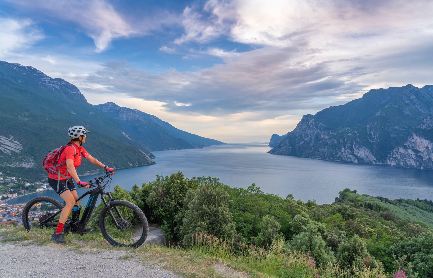 A cyclist overlooking Lake Garda in Italy