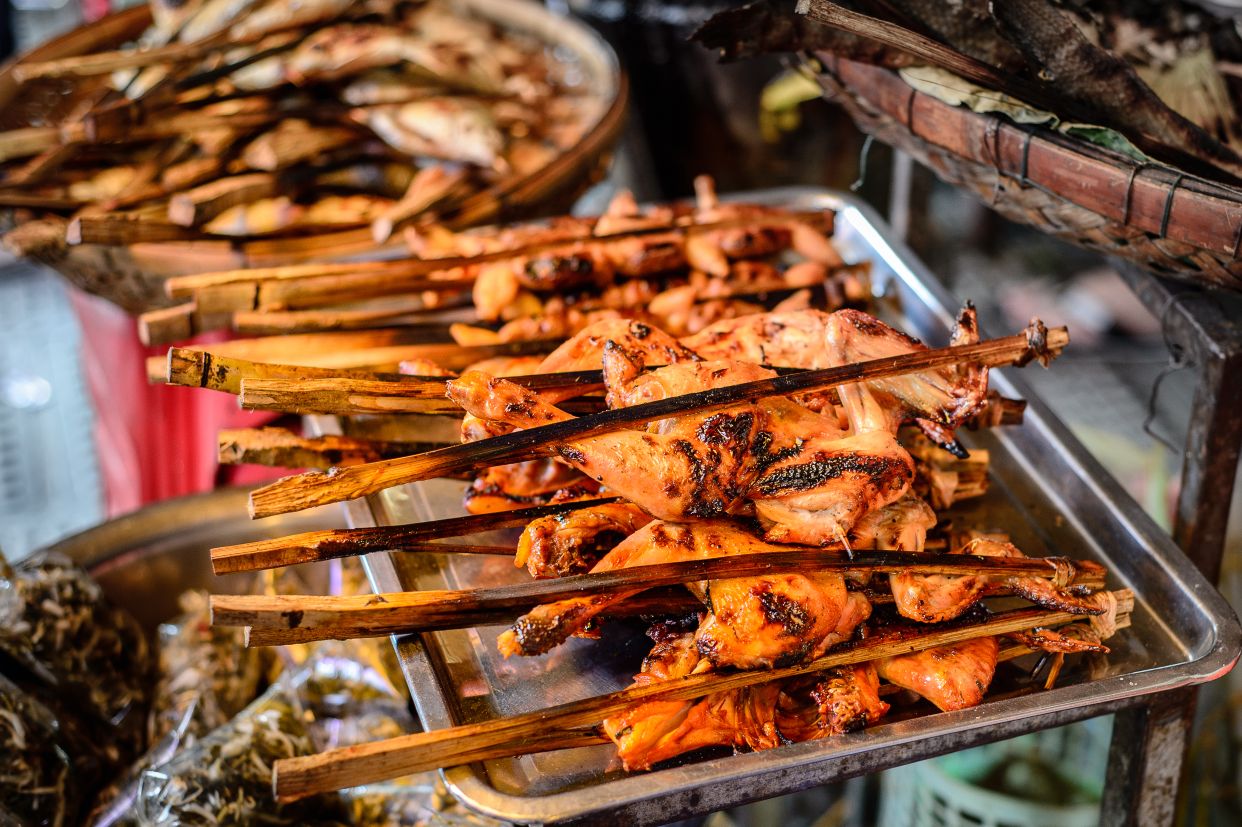 Cambodia travel tips from our local expert: slow down to richly experience the flavors of Cambodia, including street food in Phsar Thmei market, Phnom Penh
