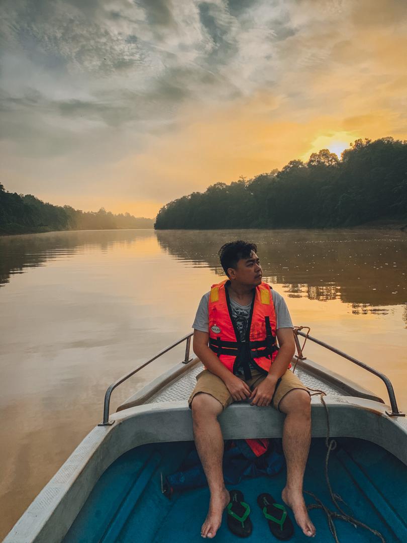 Read top Malaysia travel tips from our local agent Craig, pictured boating on the Kinabatangan River