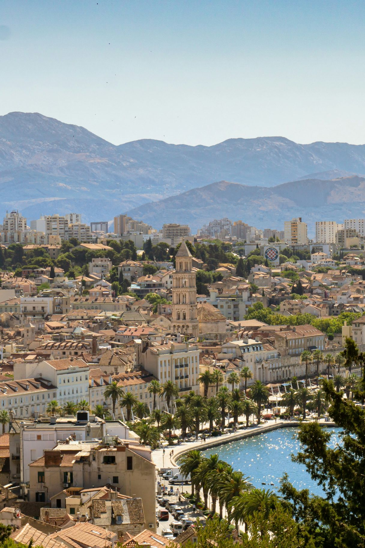 Exploring Split Croatia: Riva waterfront promenade and city landscape with mountainous backdrop