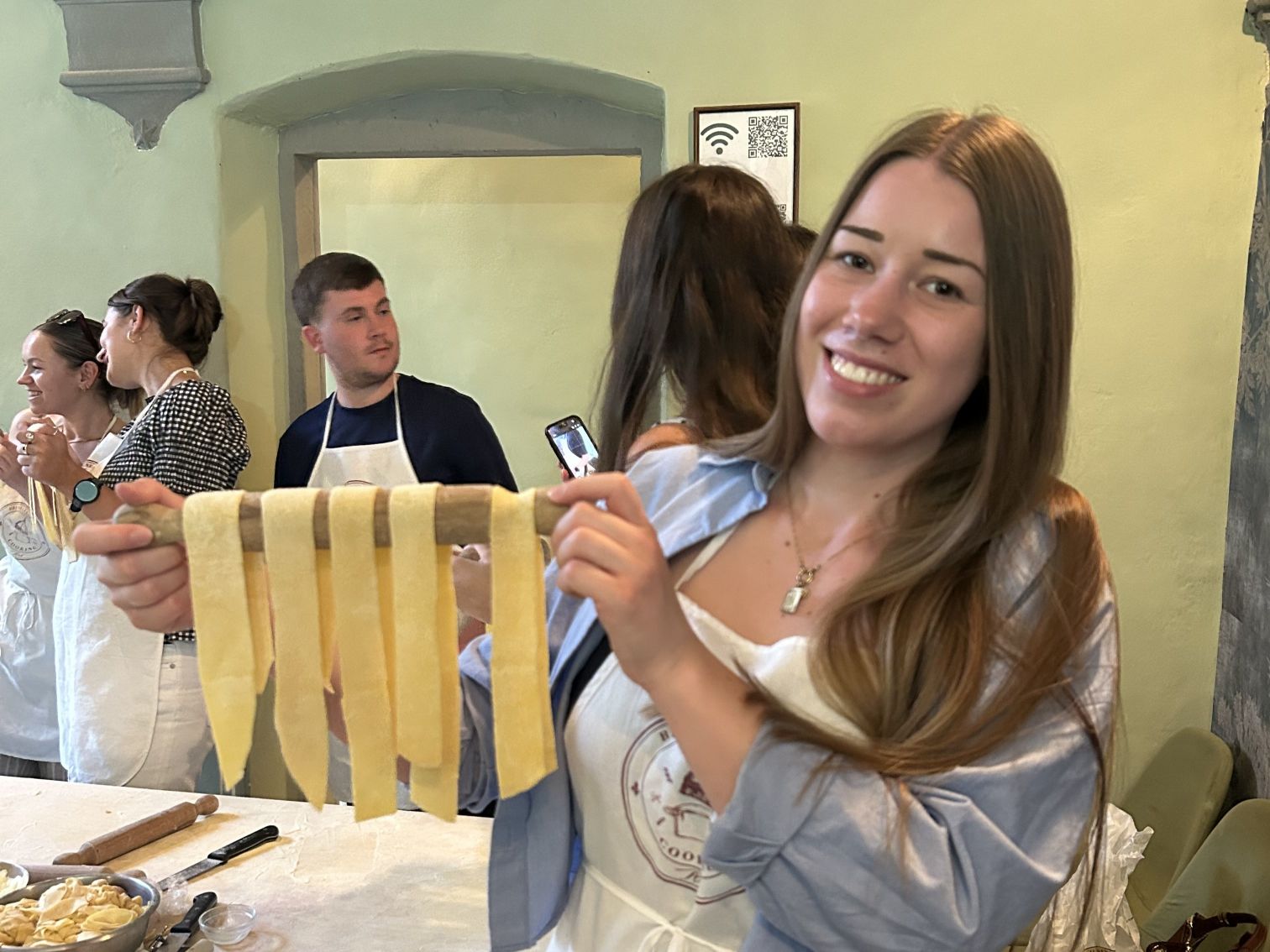 TravelLocal team member Marie cooking pasta in Italy