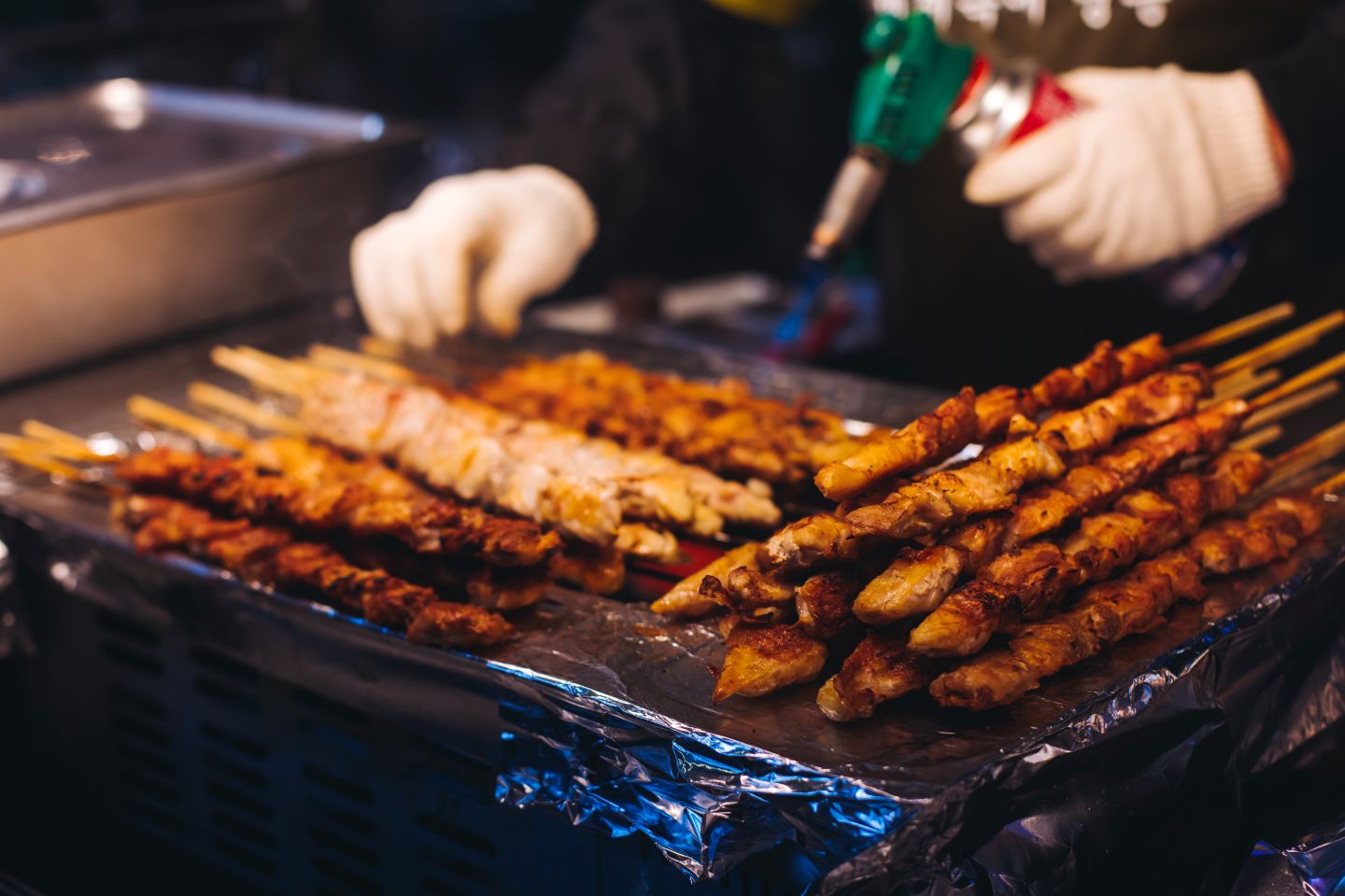 South Korean barbecue, ddakkochi, grilled chicken and pork skewers
