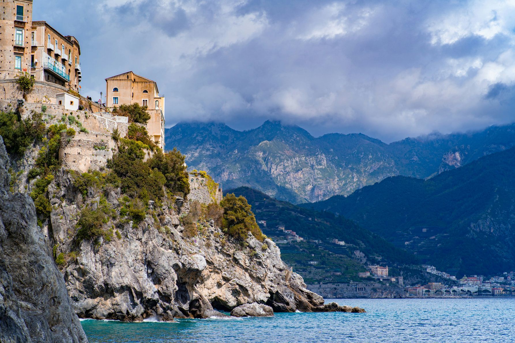 The coastal cliffs of Atrani surrounded by dramatic peaks