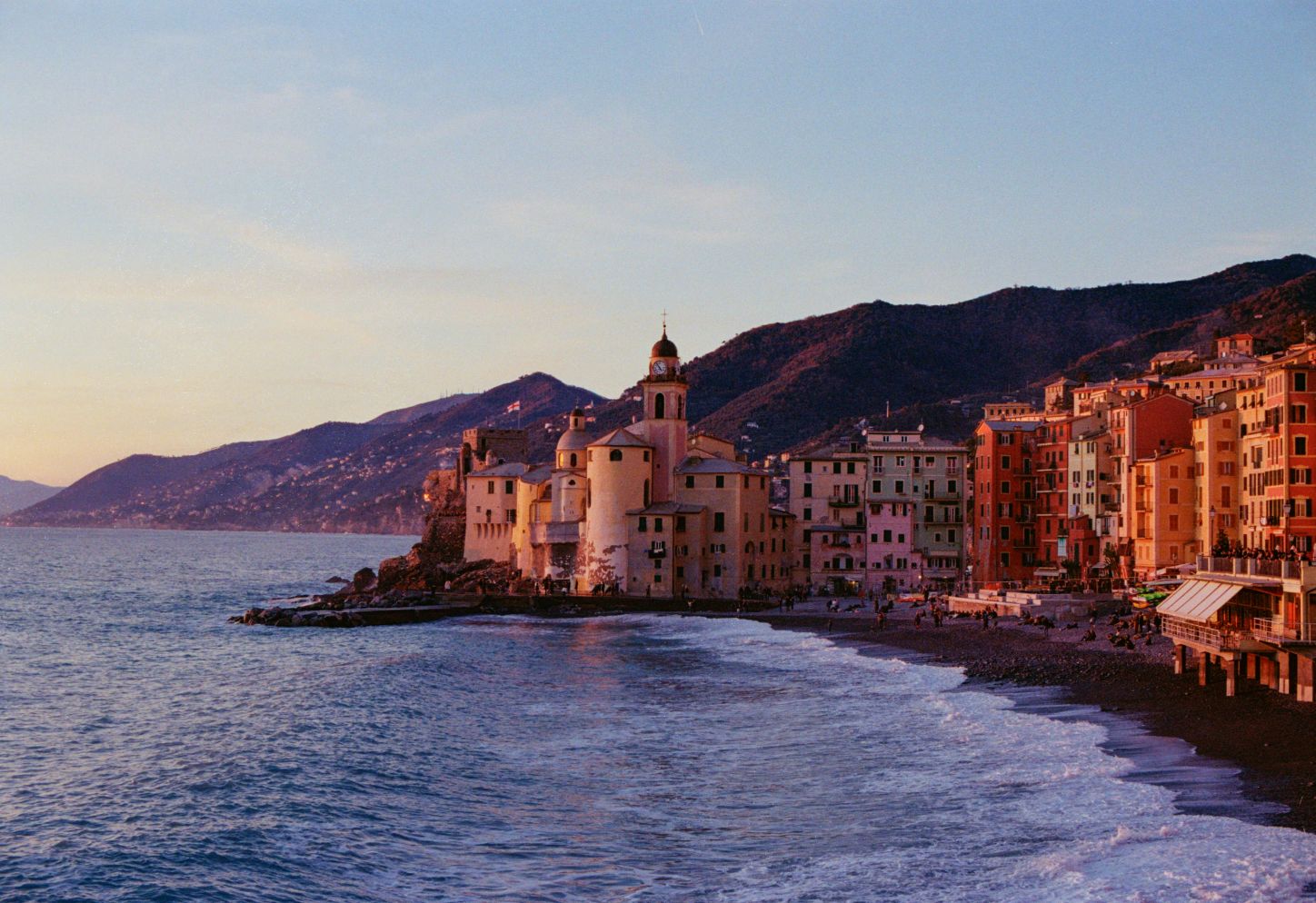 Colorful houses of Camogli on the Italian coast at sunset