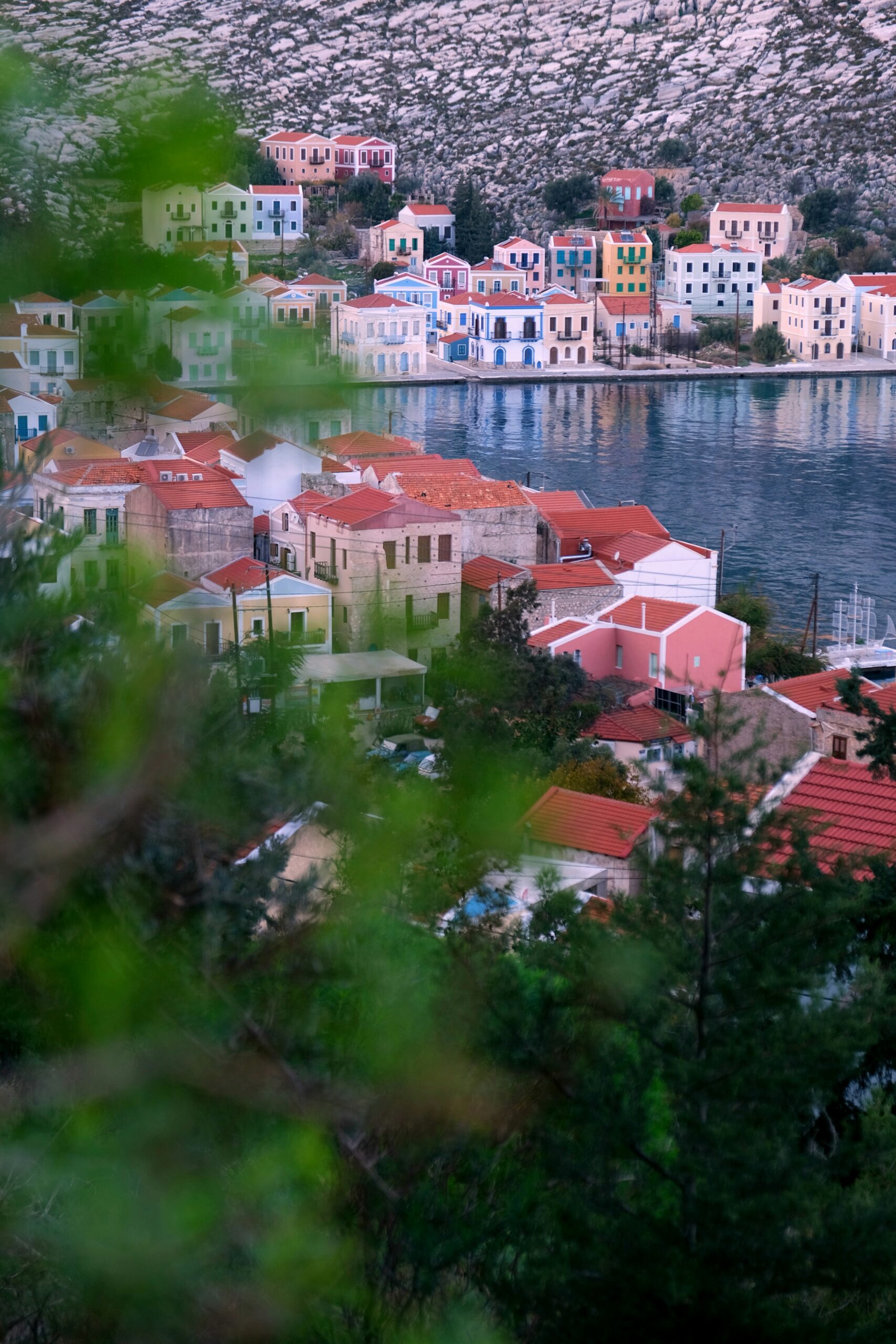 Leafy waterfront scene on the island of Kastellorizo, one of the best hidden gems in Greece for a quiet escape