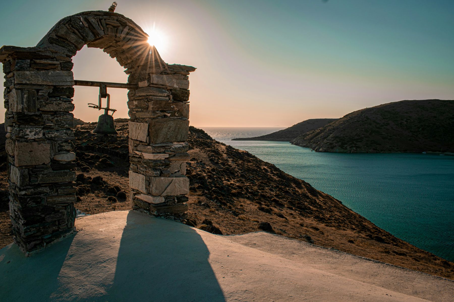 Old bell structure at sunset on the island of Kythnos, Greece