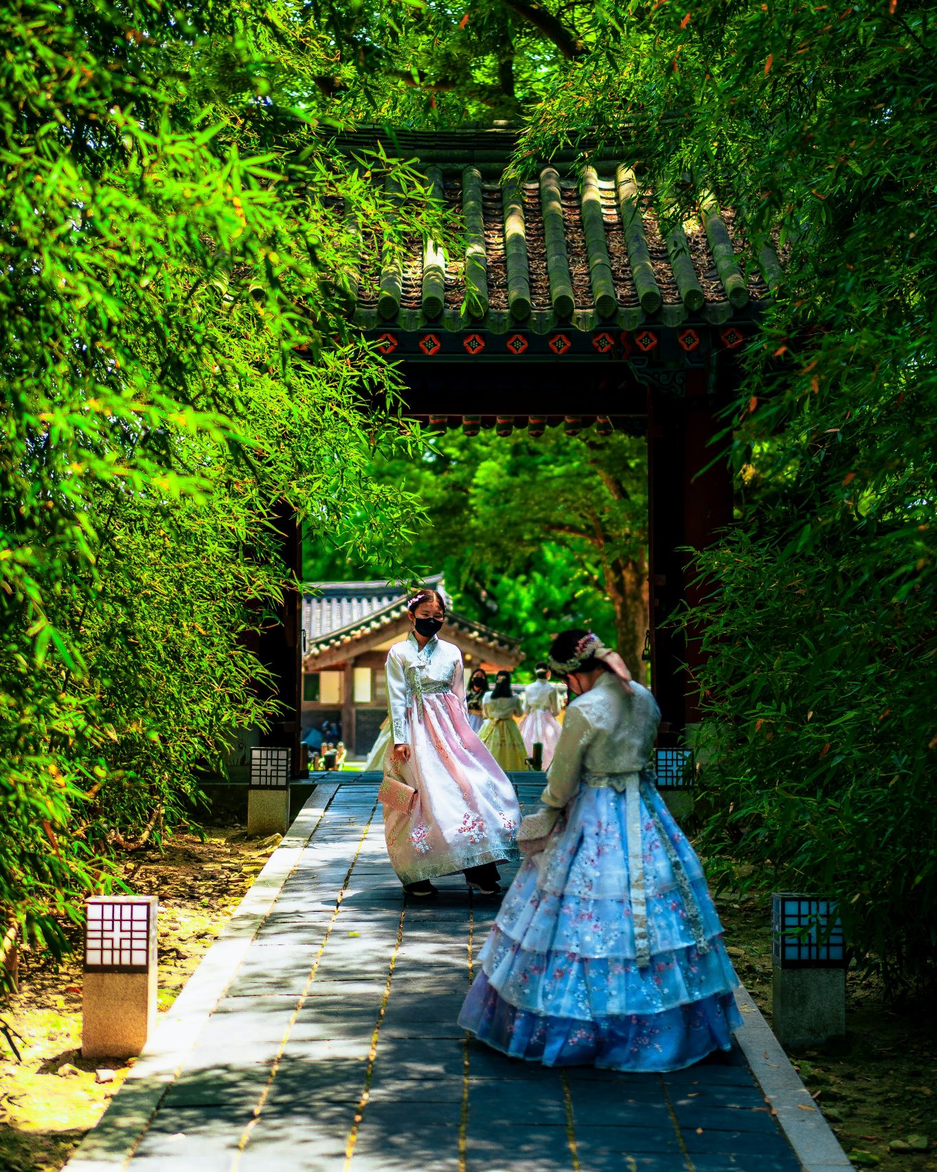 Women in traditional hanbok in summery weather in South Korea's Jeonju Hanok Village