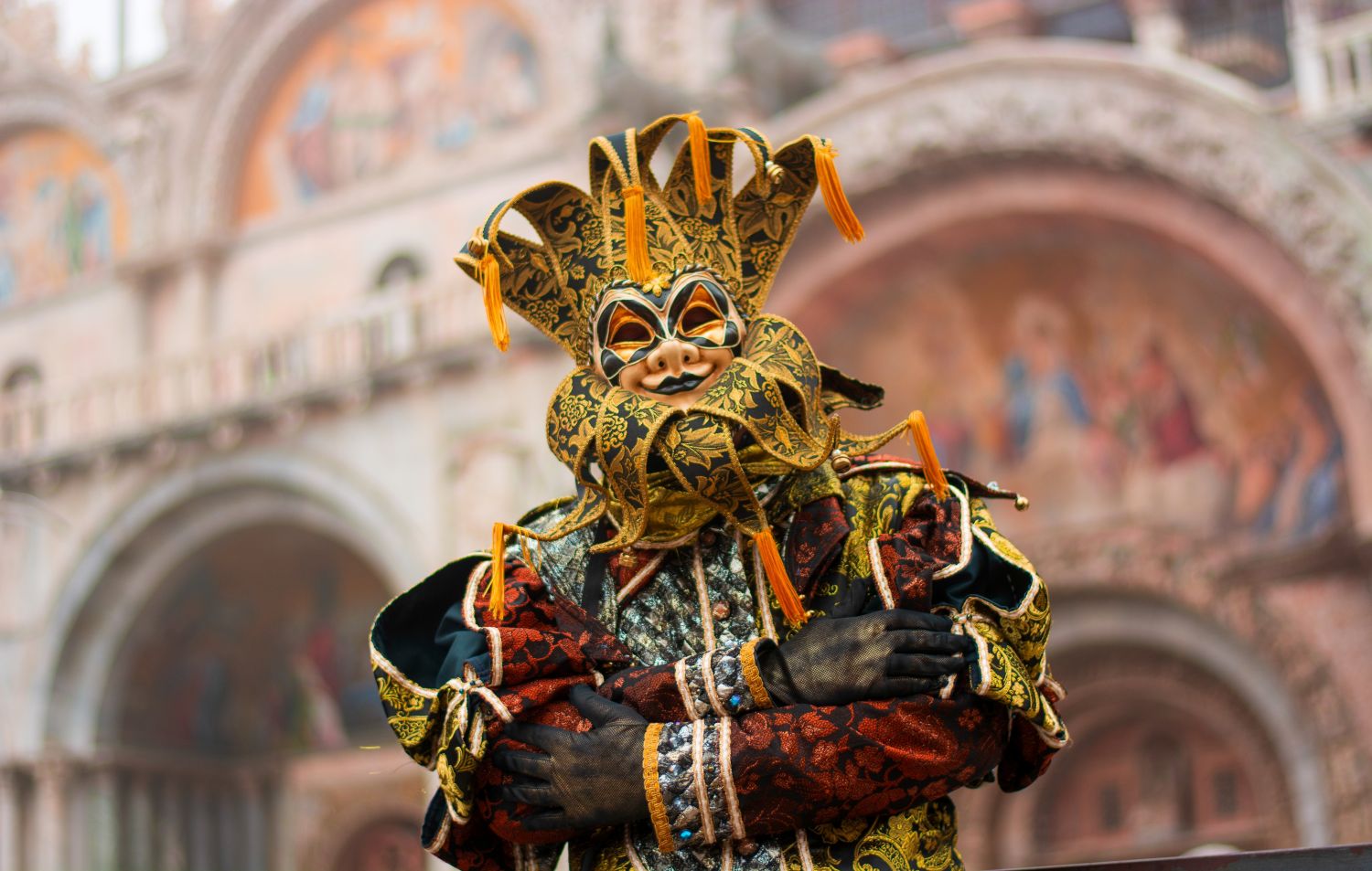 Unique cultural festivals around the world: a person dressed in an elaborate costume for Venetian Carnival celebrations