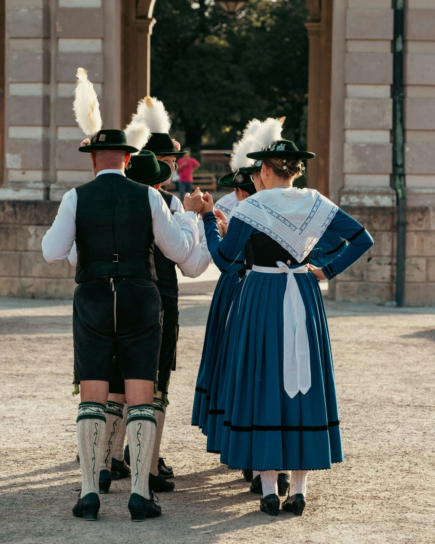 People in traditional clothing performing a folk dance during Oktoberfest in Munich