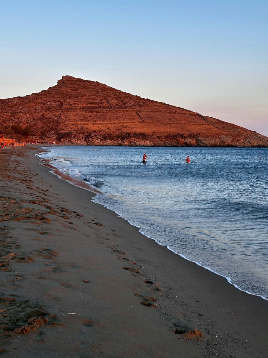 Swimmers at sundown on Tinos, Greek islands